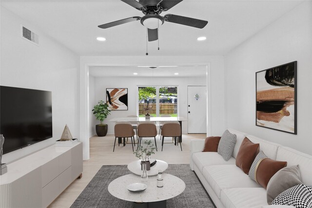 1007 N Cottonwood Dr, Richardson, TX 75080 - living room with recessed lighting, a ceiling fan, and light wood-style floors
