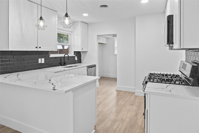 1007 N Cottonwood Dr, Richardson, TX 75080 - kitchen with a sink, baseboards, light stone countertops, white cabinetry, and light wood-style floors