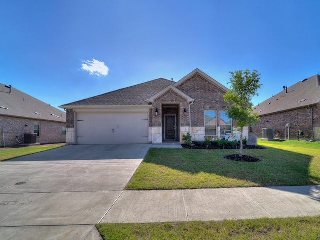 3519 Tunnel Ave, Aubrey, TX 76227 - ranch-style house with brick siding, an attached garage, concrete driveway, and central air condition unit