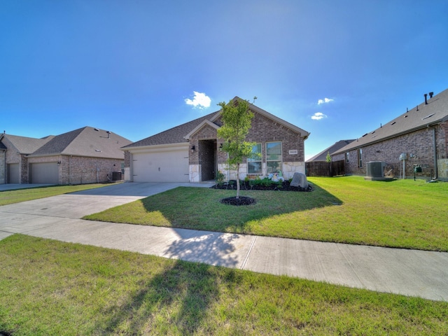 3519 Tunnel Ave, Aubrey, TX 76227 - ranch-style home featuring a garage, brick siding, concrete driveway, and central AC unit