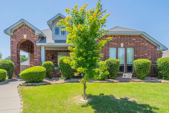 6606 Morning Dew Dr, Midlothian, TX 76065 - view of front of house featuring brick siding, a front lawn, and a shingled roof