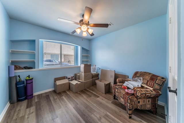 6606 Morning Dew Dr, Midlothian, TX 76065 - living area featuring wood finished floors, ceiling fan, and baseboards