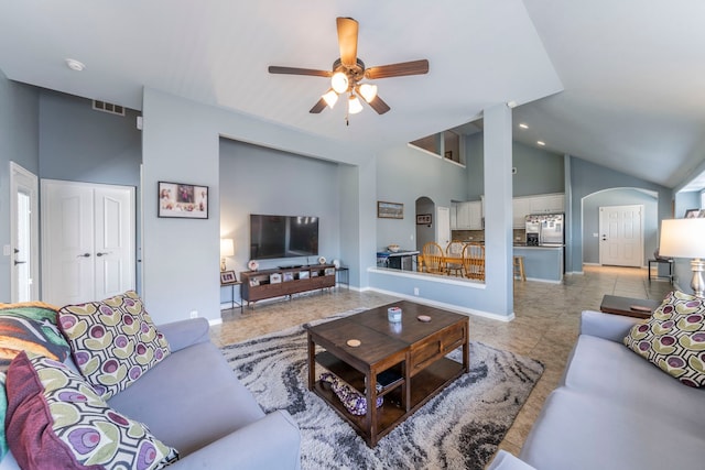 6606 Morning Dew Dr, Midlothian, TX 76065 - living area featuring arched walkways, ceiling fan, high vaulted ceiling, light tile patterned floors, and baseboards