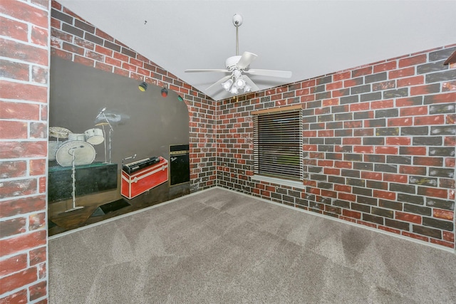 spare room featuring carpet floors, lofted ceiling, and ceiling fan