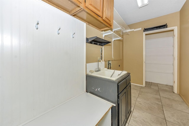 716 Bridget Way, Hurst, TX 76054 - laundry room with light tile patterned floors and a sink