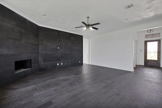 14908 S County Line Rd, Justin, TX 76247 - unfurnished living room with dark wood-type flooring, ceiling fan, crown molding, and a fireplace