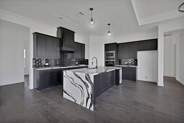 14908 S County Line Rd, Justin, TX 76247 - kitchen with stainless steel appliances, a sink, decorative backsplash, an island with sink, and light stone counters