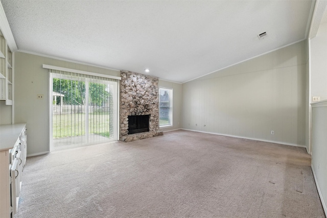 815 Middle Run, Duncanville, TX 75137 - unfurnished living room featuring vaulted ceiling, ornamental molding, light carpet, a stone fireplace, and baseboards