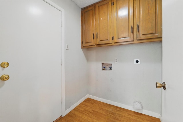 815 Middle Run, Duncanville, TX 75137 - washroom with hookup for a washing machine, cabinet space, light wood-style flooring, baseboards, and hookup for an electric dryer