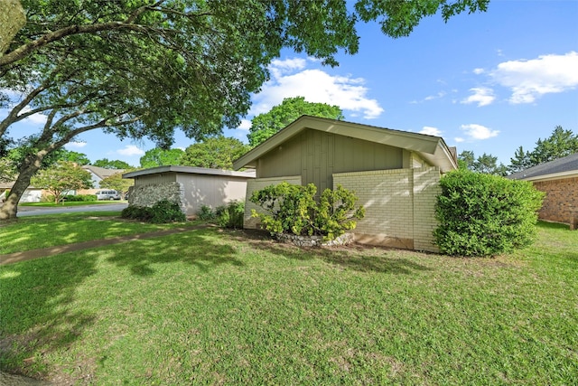 815 Middle Run, Duncanville, TX 75137 - view of side of property featuring brick siding and a yard