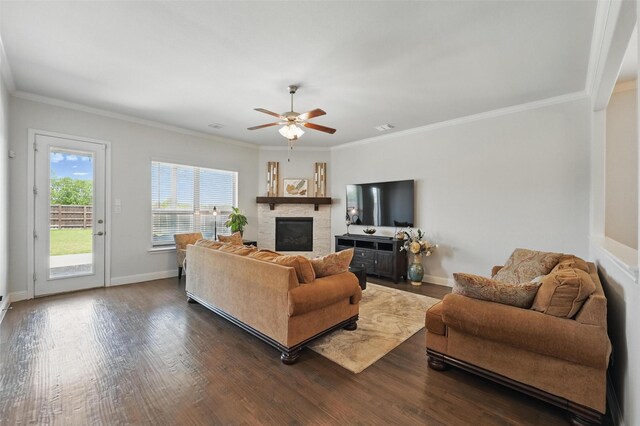 7205 York St, North Richland Hills, TX 76180 - living area with a ceiling fan, a fireplace, dark wood-style flooring, crown molding, and baseboards