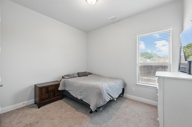 7205 York St, North Richland Hills, TX 76180 - bedroom featuring baseboards and light colored carpet