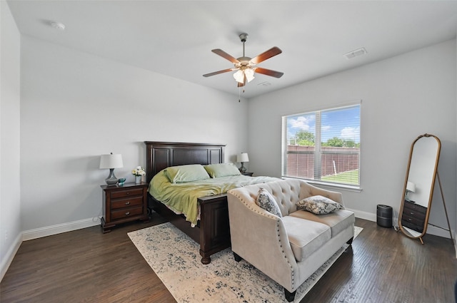 7205 York St, North Richland Hills, TX 76180 - bedroom with baseboards, dark wood-style floors, and ceiling fan