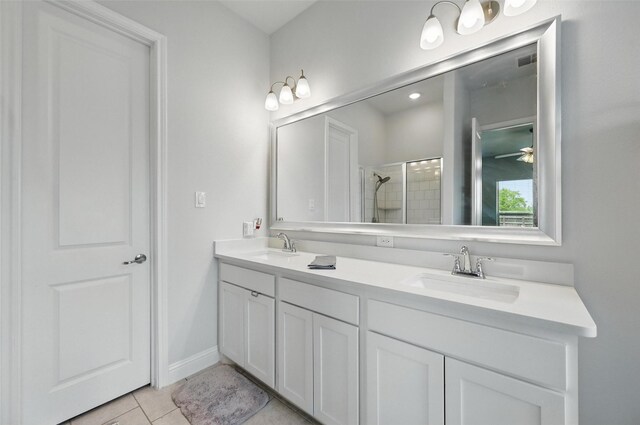 7205 York St, North Richland Hills, TX 76180 - full bath with a shower stall, double vanity, tile patterned floors, and ceiling fan