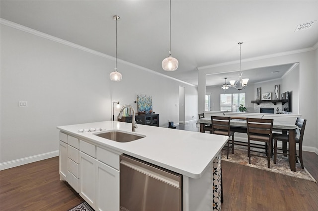 7205 York St, North Richland Hills, TX 76180 - kitchen featuring stainless steel dishwasher, a sink, open floor plan, dark wood finished floors, and crown molding