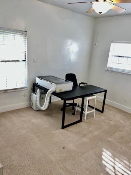 522 Helena St, Dallas, TX 75217 - office area with ceiling fan, baseboards, light colored carpet, and plenty of natural light