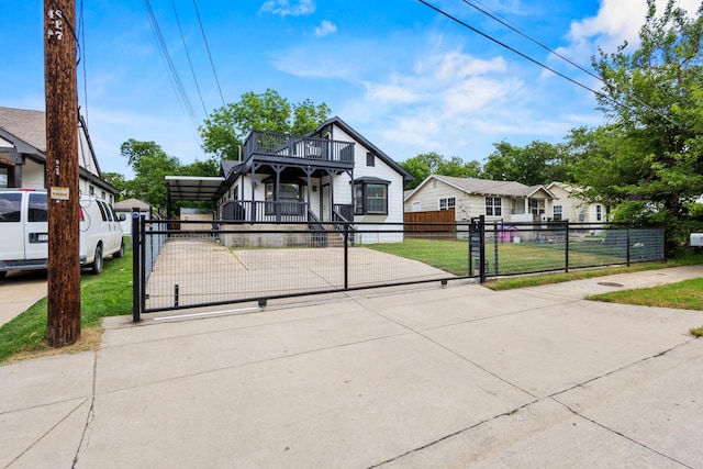 522 Helena St, Dallas, TX 75217 - view of front of house with a gate and a balcony