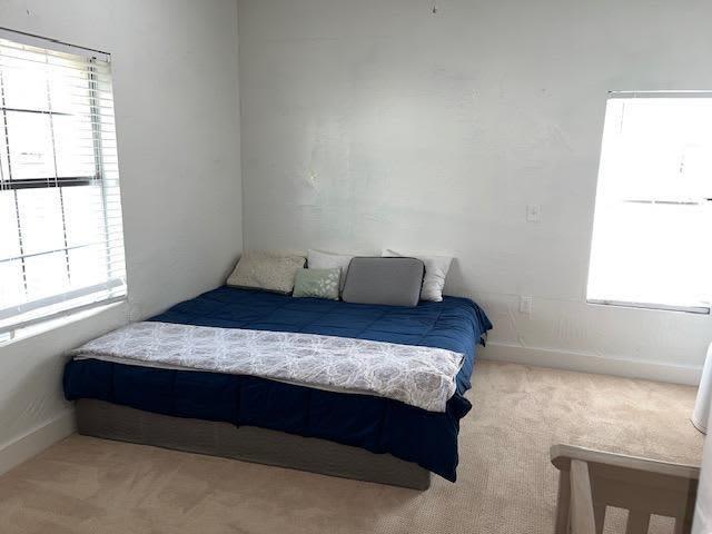 522 Helena St, Dallas, TX 75217 - carpeted bedroom with baseboards