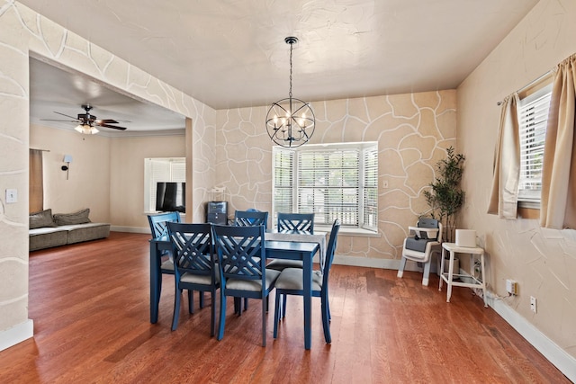 522 Helena St, Dallas, TX 75217 - dining space with a chandelier, wood finished floors, baseboards, and ceiling fan