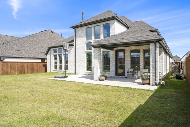 2229 Boboli Ct, Celina, TX 75009 - back of house featuring a shingled roof, brick siding, and a patio