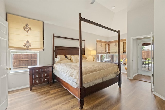 2671 Marshall Dr, Frisco, TX 75033 - bedroom featuring access to exterior, wood finished floors, baseboards, and a high ceiling