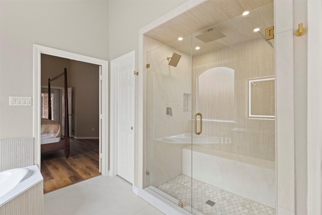 2671 Marshall Dr, Frisco, TX 75033 - bathroom with ensuite bathroom, a shower stall, recessed lighting, a bathtub, and wood finished floors