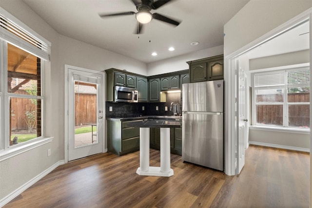 2671 Marshall Dr, Frisco, TX 75033 - kitchen with stainless steel appliances, a ceiling fan, plenty of natural light, a sink, and recessed lighting