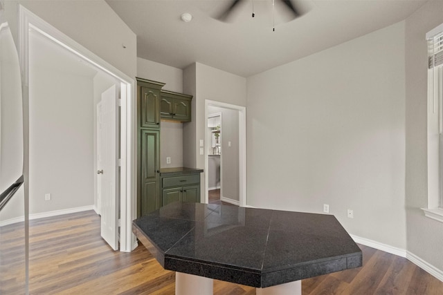2671 Marshall Dr, Frisco, TX 75033 - unfurnished bedroom with dark wood-style floors, baseboards, a ceiling fan, and freestanding refrigerator
