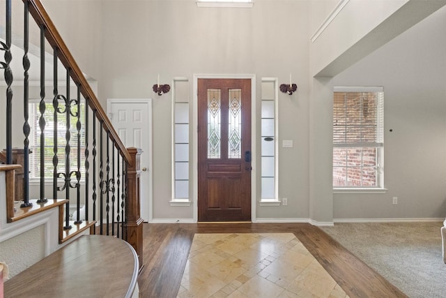2671 Marshall Dr, Frisco, TX 75033 - foyer featuring a high ceiling, stairway, plenty of natural light, and baseboards