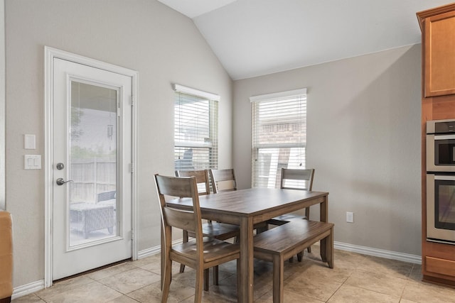 6620 Roaring Crk, Denton, TX 76226 - dining room featuring vaulted ceiling, baseboards, and light tile patterned floors