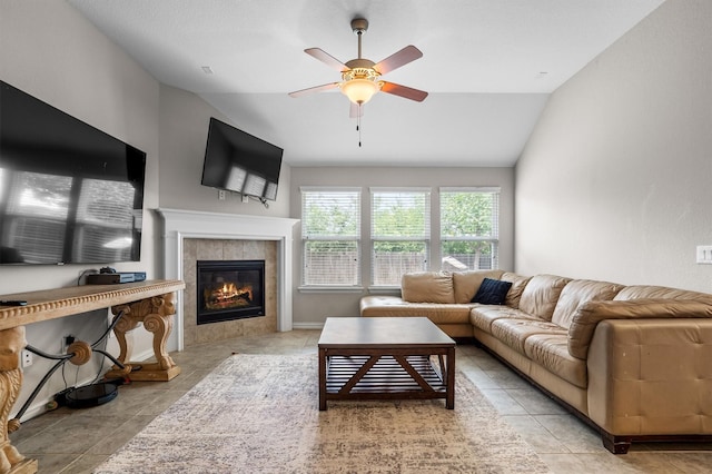 6620 Roaring Crk, Denton, TX 76226 - tiled living room with lofted ceiling, a ceiling fan, and a tiled fireplace