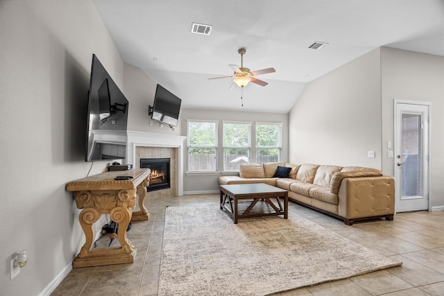 6620 Roaring Crk, Denton, TX 76226 - tiled living room featuring baseboards, vaulted ceiling, ceiling fan, and a tile fireplace