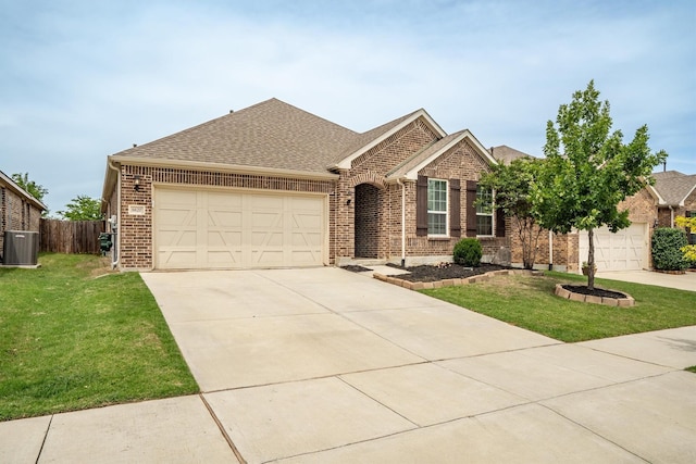 6620 Roaring Crk, Denton, TX 76226 - view of front of home featuring brick siding, concrete driveway, an attached garage, cooling unit, and roof with shingles