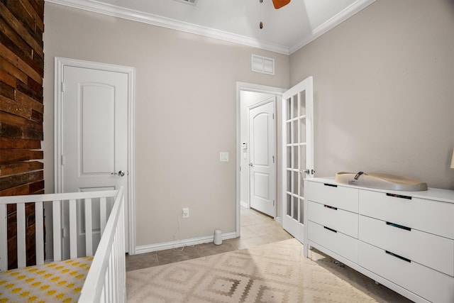 6620 Roaring Crk, Denton, TX 76226 - bedroom with crown molding, light tile patterned flooring, baseboards, and a nursery area