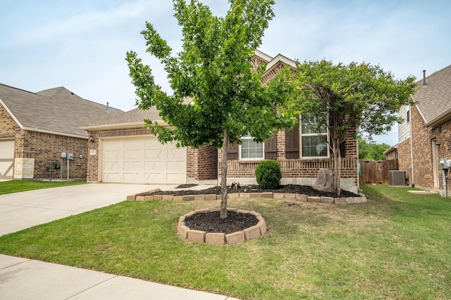 6620 Roaring Crk, Denton, TX 76226 - view of property hidden behind natural elements featuring central air condition unit, driveway, an attached garage, brick siding, and a front yard