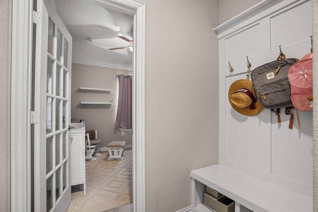 6620 Roaring Crk, Denton, TX 76226 - mudroom with ornamental molding, ceiling fan, and baseboards