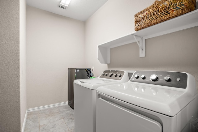 6620 Roaring Crk, Denton, TX 76226 - laundry room with independent washer and dryer, baseboards, and light tile patterned floors