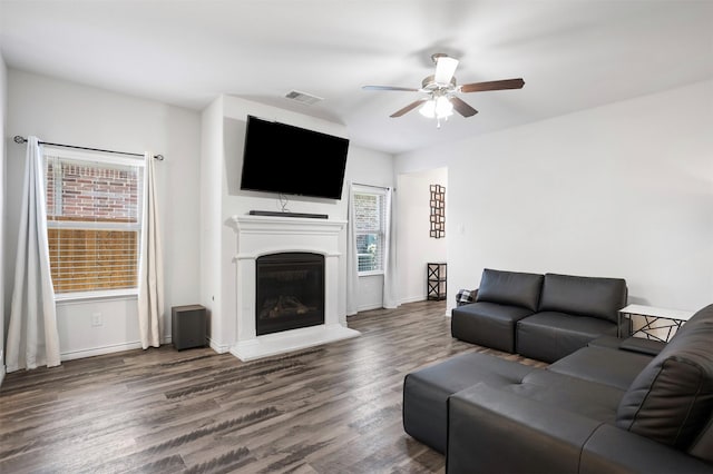 2619 Pinckney Ct, Forney, TX 75126 - living room with a ceiling fan, wood finished floors, a glass covered fireplace, and baseboards