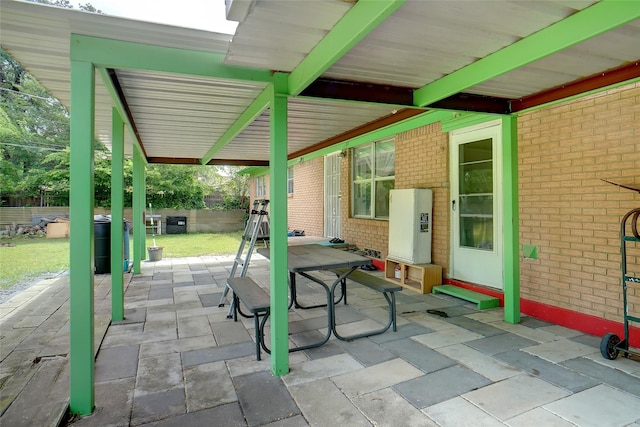 4805 Ira St, Haltom City, TX 76117 - view of patio with fence and outdoor dining space
