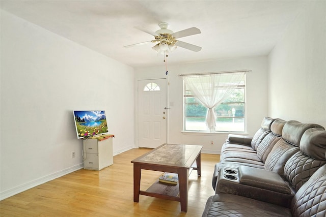 4805 Ira St, Haltom City, TX 76117 - living room featuring light wood-style floors, baseboards, and ceiling fan