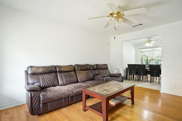 4805 Ira St, Haltom City, TX 76117 - living room with wood finished floors, a ceiling fan, and baseboards