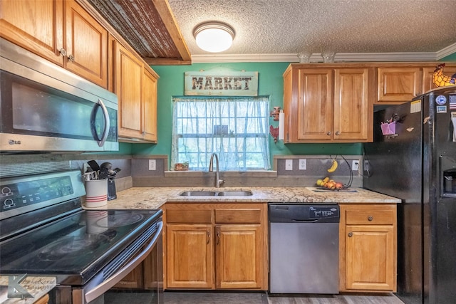 225 Field St, Clyde, TX 79510 - kitchen featuring appliances with stainless steel finishes, a sink, ornamental molding, light stone counters, and brown cabinetry