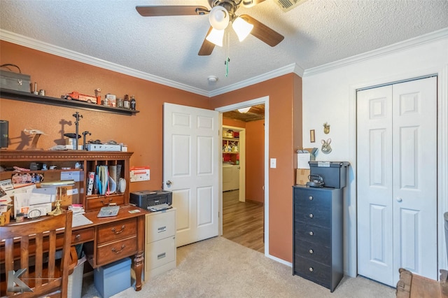 225 Field St, Clyde, TX 79510 - office area featuring a ceiling fan, washer / dryer, ornamental molding, a textured ceiling, and light carpet