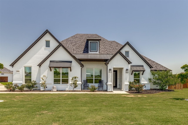 9104 Lazy Oak Dr, Justin, TX 76247 - view of front of property featuring a standing seam roof, a front yard, metal roof, a shingled roof, and brick siding