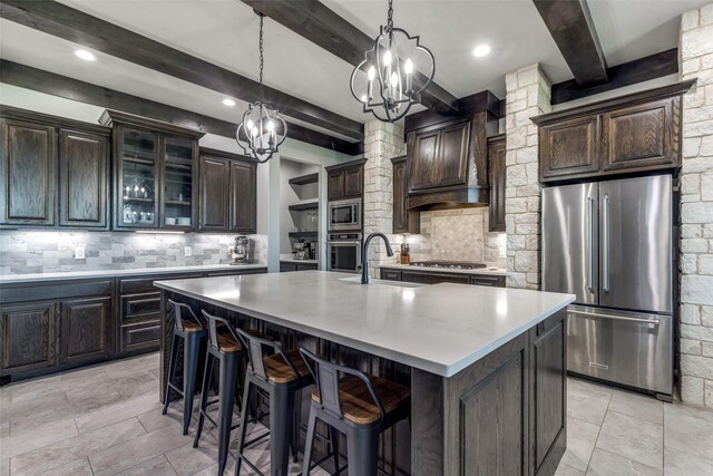 9104 Lazy Oak Dr, Justin, TX 76247 - kitchen with appliances with stainless steel finishes, a sink, a chandelier, beamed ceiling, and backsplash