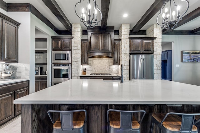 9104 Lazy Oak Dr, Justin, TX 76247 - kitchen with stainless steel appliances, a chandelier, beam ceiling, decorative backsplash, and light countertops