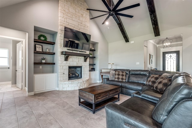 9104 Lazy Oak Dr, Justin, TX 76247 - living area with built in shelves, a chandelier, high vaulted ceiling, ceiling fan, and a fireplace