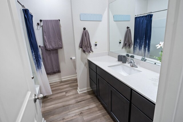 8213 Smokey Creek Pass, Fort Worth, TX 76179 - full bathroom featuring wood finished floors, vanity, and baseboards