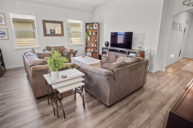 8213 Smokey Creek Pass, Fort Worth, TX 76179 - living area with light wood finished floors, baseboards, and lofted ceiling