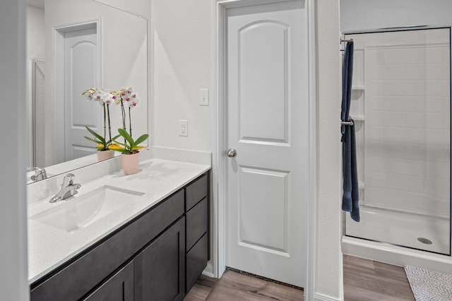 8213 Smokey Creek Pass, Fort Worth, TX 76179 - bathroom featuring wood finished floors, vanity, and a stall shower